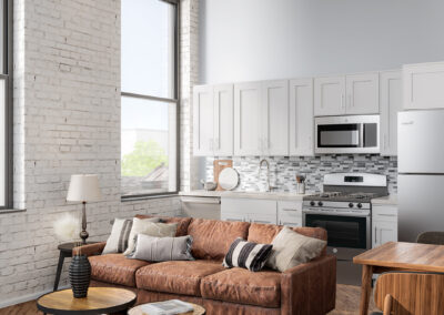 Furnished living room area with brown couch, wooden coffee tables, and small dining table to side.