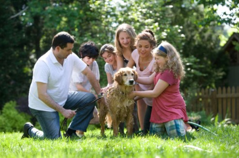 Family outside with their dog