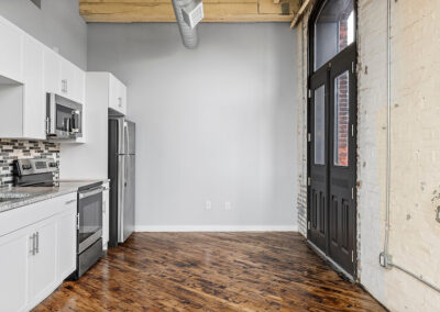 Dining area with a lot of natural lighting from windows and double doors.