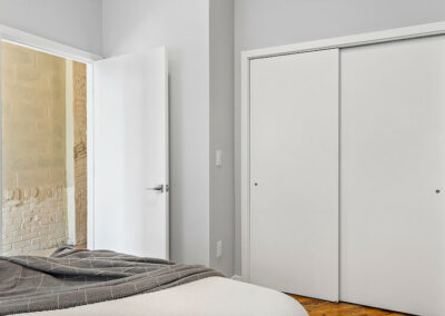 Bedroom with sliding door closet.